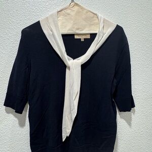 Black Sweater with Cream Scarf Accent